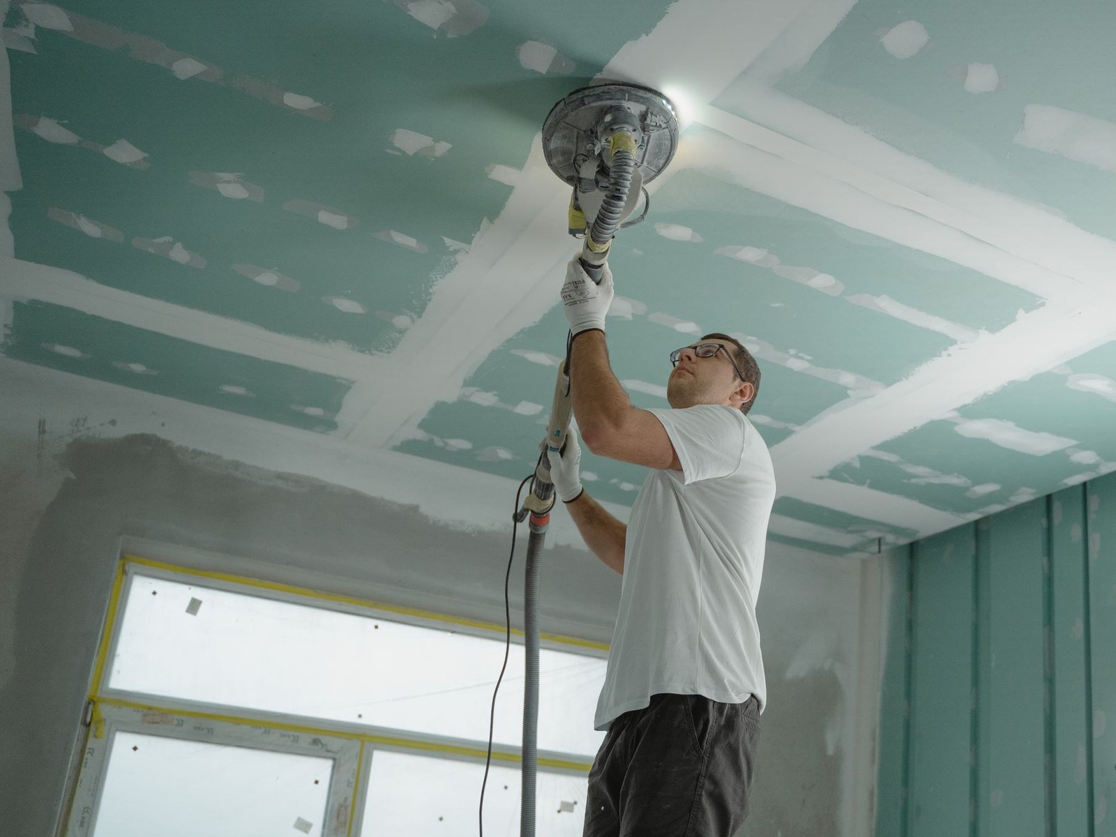 Professional ceiling sanding and preparation - illustrative stock photo
