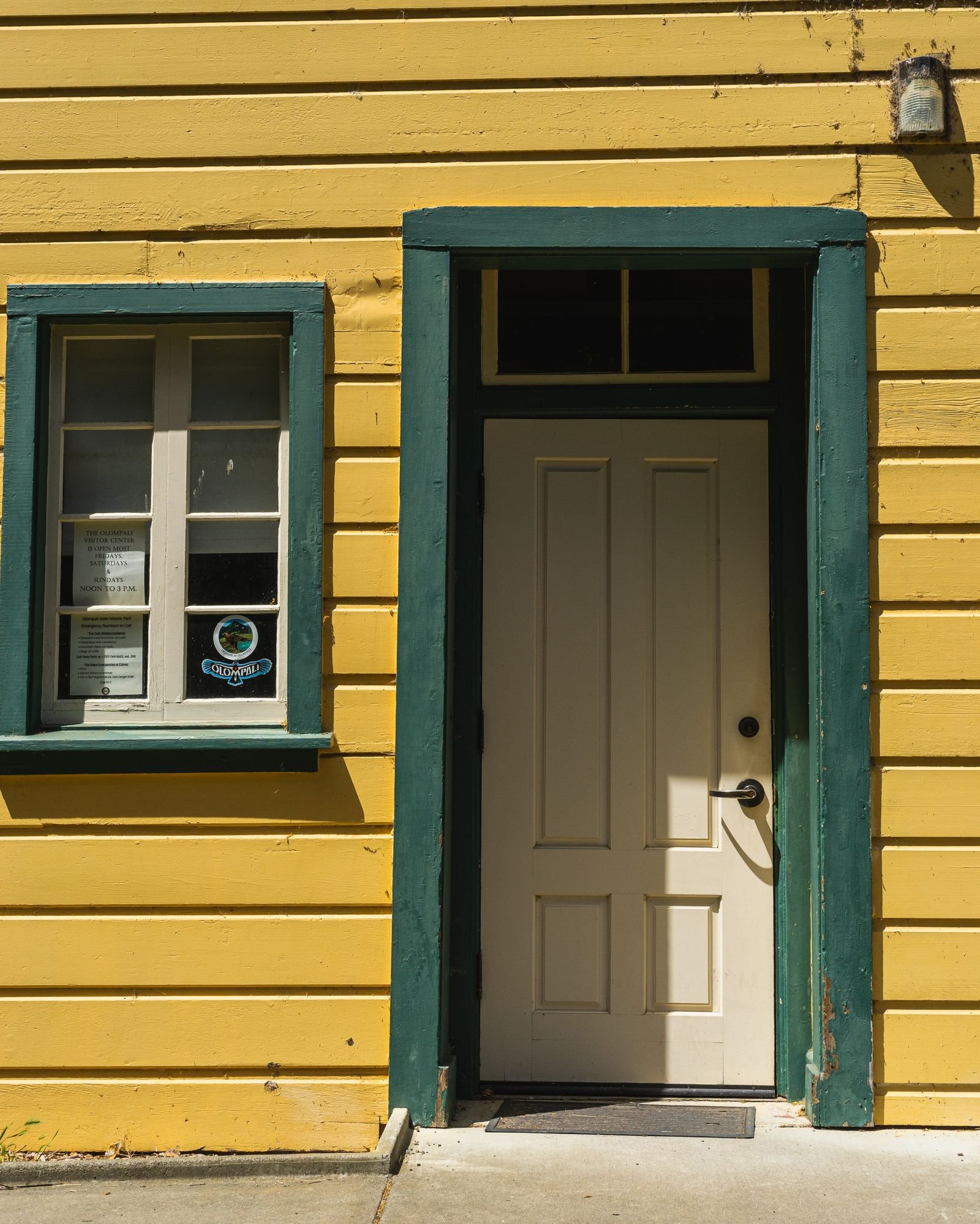 Painted wooden house exterior with contrasting door and trim - illustrative stock photo