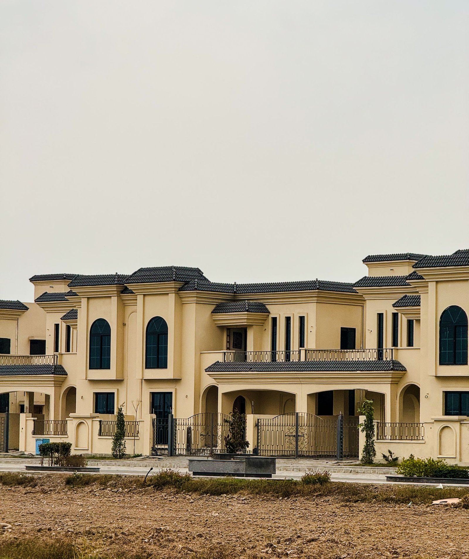 Large modern luxury villa with arched windows - illustrative stock photo